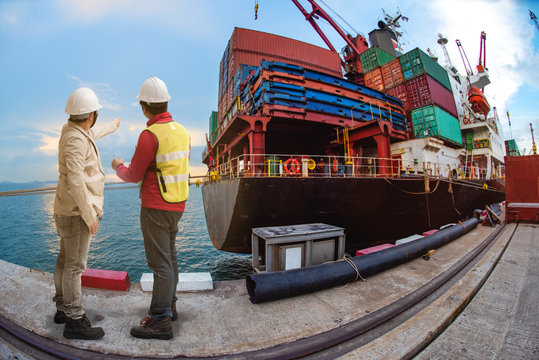 merchandiser trading with port manager review the shipment cargo in port terminal, the carrier ship container in transition of cargo from port loading to destination delivery
