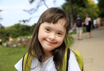 Portrait of little girl smiling in the park
