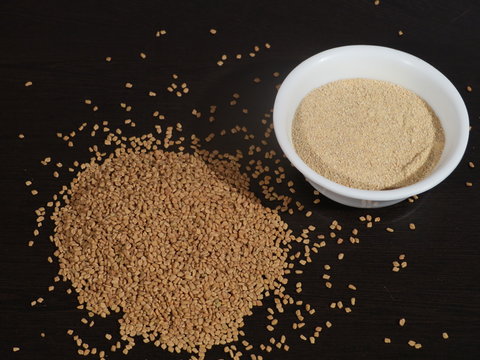 Fenugreek Seeds or Methi Dana drink by soaking it in water overnight. helpful in weight loss, digestion and blood sugar treatment, Methi Dana Drink in Glass on Wooden Background