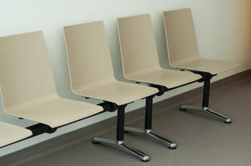 Closeup of beige chair alignment in a waiting room