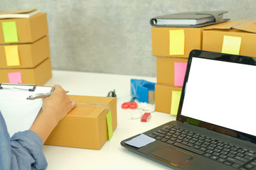 startup business owner working at workplace. man seller check order. Online selling, e-commerce...