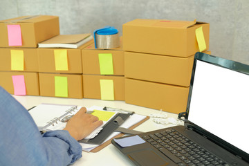startup business owner working at workplace. man seller check order. Online selling, e-commerce...