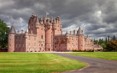 The Castle of Glamis is the typical Scottish castle, stately, full of turrets and battlements, was...