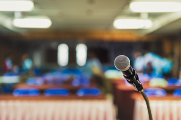 Blurred and Soft focus of head microphone on stage of Education meeting or event whit blurred...