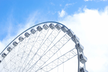 Ferris wheel against the bright blue sky