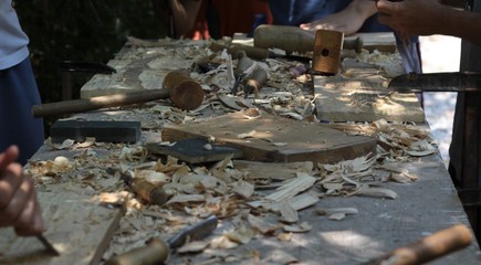 woodworking table covered with wood shavings