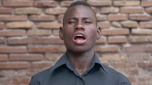 Portrait of Funny young african man yawning- slow motion
