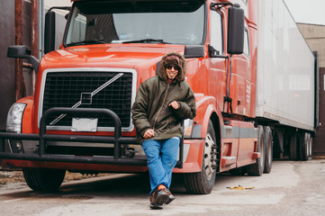 Truck driver sitting on the truck