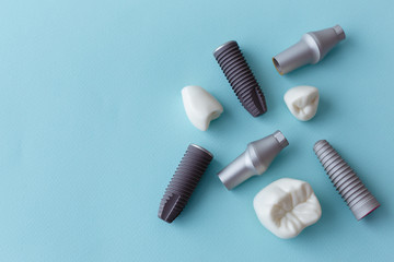 This model shows that teeth have been capped and the stainless pin in the gums. blue background