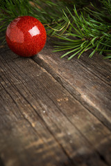 Decorations of green fir branches, red glass Christmas balls