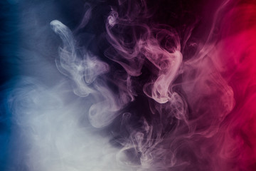 abstract colorful smoke and shapes on dark background