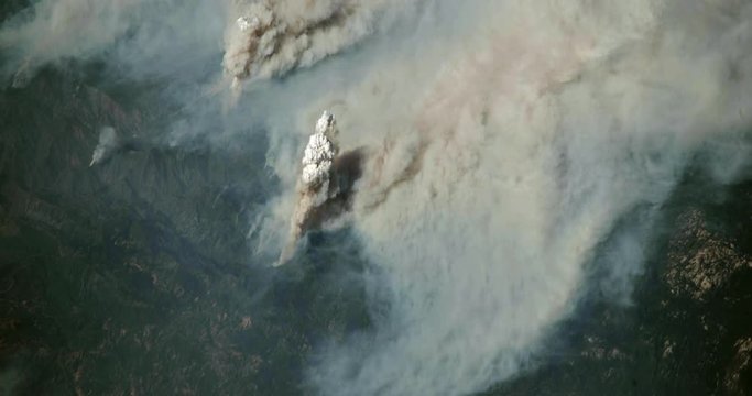 Very high-altitude overflight aerial of the Ferguson fire near Yosemite National Park, 2018. Clip loops and is reversible. Elements of this image furnished by USGS/NASA Landsat