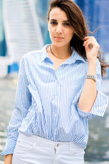 portrait of a beautiful brunette in the city