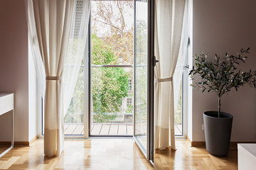 Modern apartment view through open terrace door