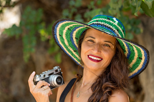 Smiling Solo Traveller Female With Vintage Film Camera.