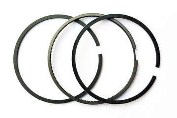 new car piston rings on isolated white background close-up