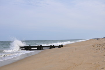 Beach Pier with Waves Crashing