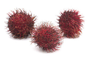 Group of Fresh Red Rambutan Isolated on a White Background
