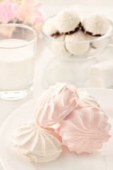 Breakfast. High key. Marshmallow, glass of milk and cookies