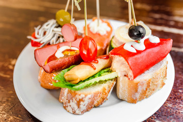 Spanish Tapas as traditional cuisine on vintage table in restaurant