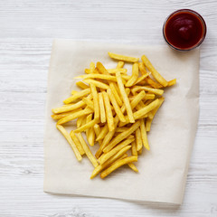 French fries with ketchup, top view. Copy space.