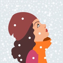 girl in winter clothes on a background of winter sky	