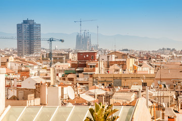 Rooftops of Barcelona, Spain with Sagrada Familia at the Background