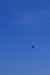 Hot air baloon on blue sky.