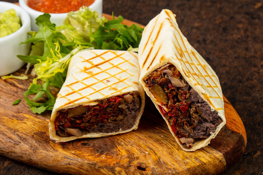 Delicious burito with sauce