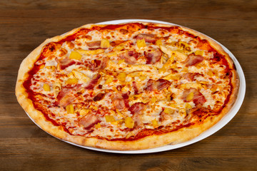 Pizza with bacon and pineapple