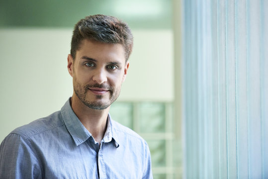 Portrait of engineer standing in office