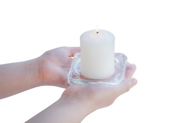 Female hand holding a white candle on a white background isolated.