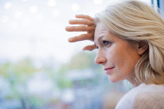 Businesswoman standing near window