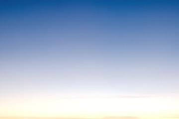 Light blue sky with clouds, may be used as background