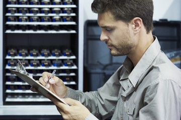 Engineer checking document in office