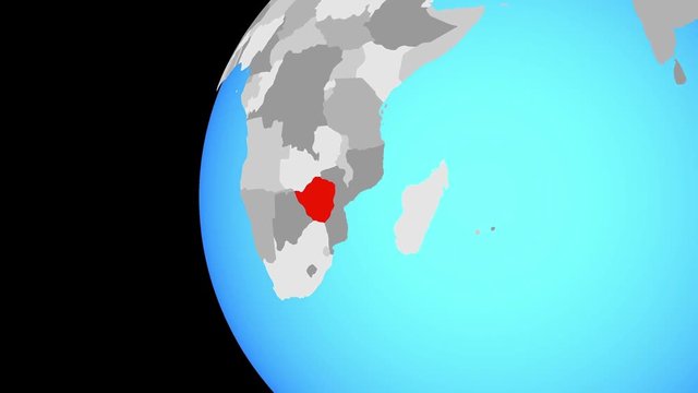 Zimbabwe on blue political globe. Orbiting around globe and zooming to the country. 3D illustration.