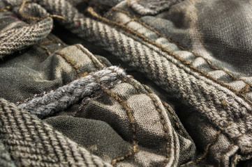 clothing items washed cotton fabric texture with seams, clasps, buttons and rivets