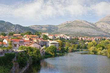 Town on river bank. Bosnia and Herzegovina, Republika Srpska. View of Trebisnjica river and Trebinje town