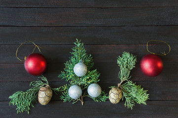 Christmas decorations on dark  background. Flat lay, free space for text