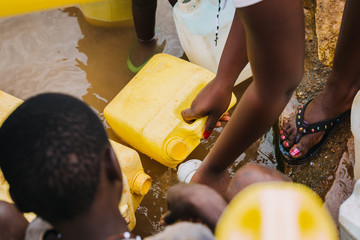 People getting water at a well in Uganda, Africa