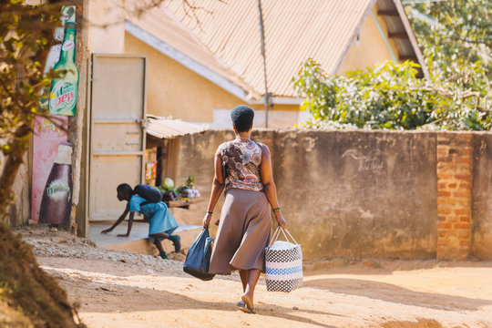 woman carrying bags in Entebbe, Uganda