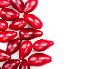 Red berries of cornel or dogwood isolated on white background with copy space for your text. Top view. Flat lay