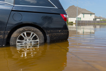 Car submerged  in Texas, US during hurricane Harvey. Water could enter the engine, transmission parts or other places. Disaster Motor Vehicle Insurance Claim Themed. Severe weather concept