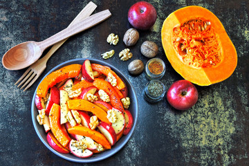 Pumpkin salad with apples and walnuts. Recipe for salad with pumpkin and apples. Vegan nutritious pumpkin salad. Healthy Apple Salad with Pumpkin and Nuts.