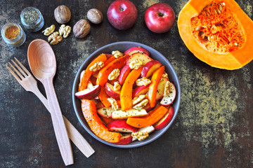 Pumpkin salad with apples and walnuts. Recipe for salad with pumpkin and apples. Vegan nutritious pumpkin salad. Healthy Apple Salad with Pumpkin and Nuts.