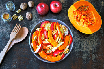 Pumpkin salad with apples and walnuts. Recipe for salad with pumpkin and apples. Vegan nutritious pumpkin salad. Healthy Apple Salad with Pumpkin and Nuts.