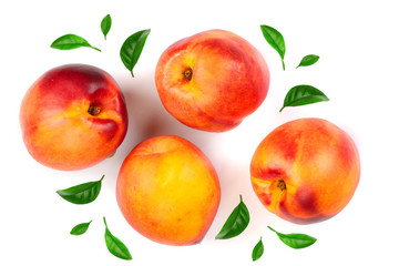ripe nectarine with leaves isolated on white background. Top view. Flat lay pattern