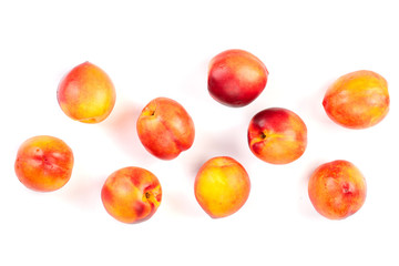 ripe nectarine with leaves isolated on white background with copy space for your text. Top view. Flat lay pattern