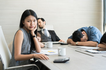 Bored business people and sleeping resting on workplace during work meeting, concept of exhausted...