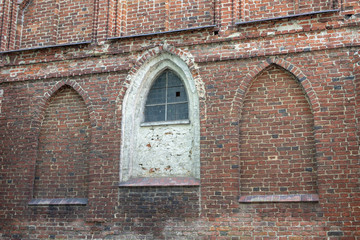 An old church in Central Europe. A religious building of red brick worship.